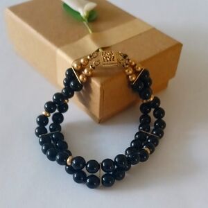 Stunning Black and Gold Bracelet with Double-Stranded Design and Polished Beads